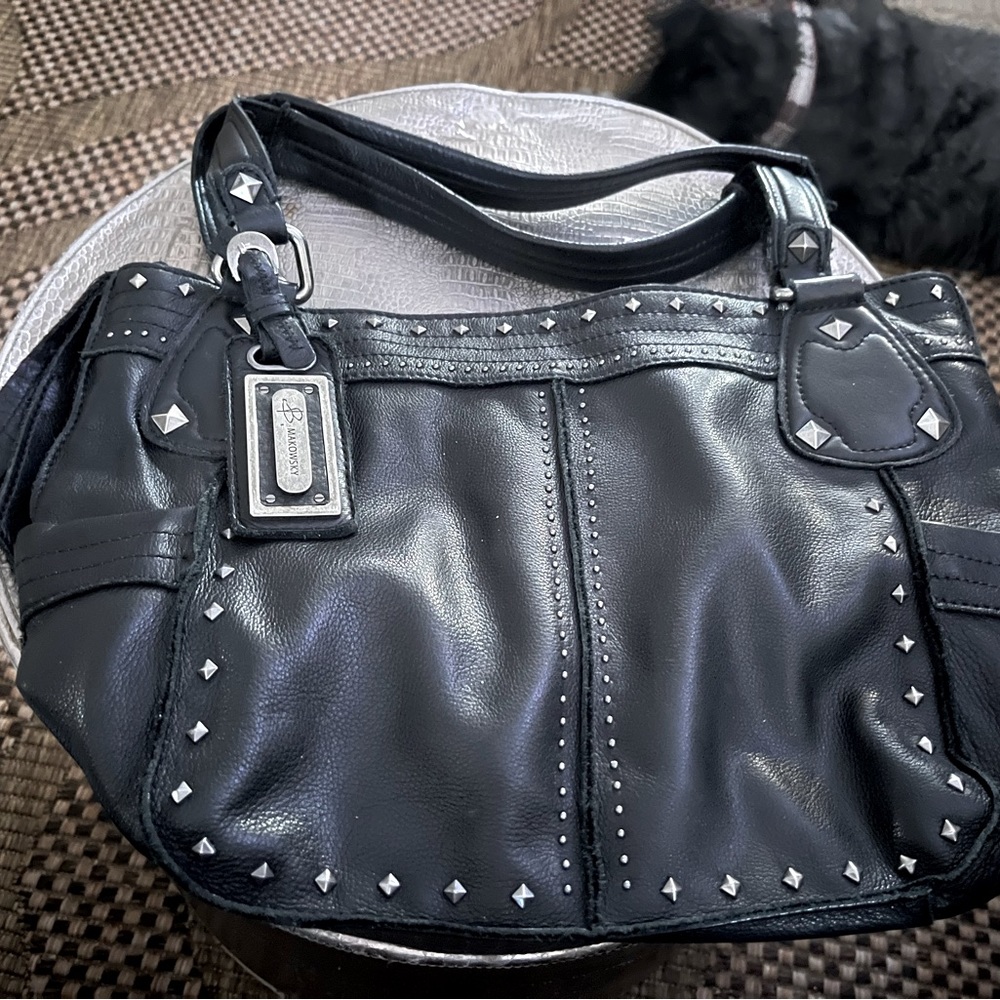 B Makowsky Studded soft leather bag.Like new condition cell phone slot in back